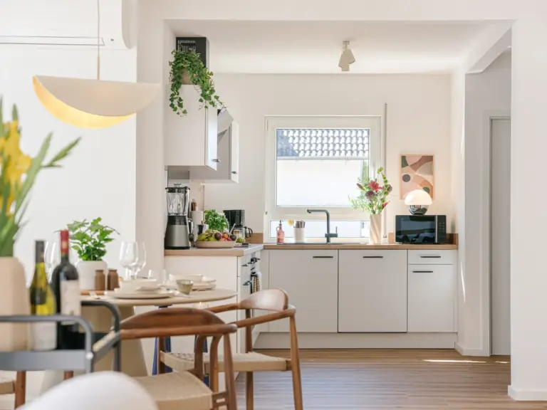 Dining area and kitchen at Stay Eden MOONSTONE GREEN, a modern Ramstein TDY apartment.