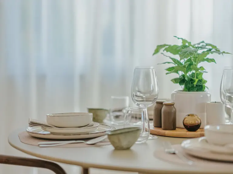 Dining area with beautifully set table at Stay Eden MOONSTONE GREEN, a Ramstein TDY home.