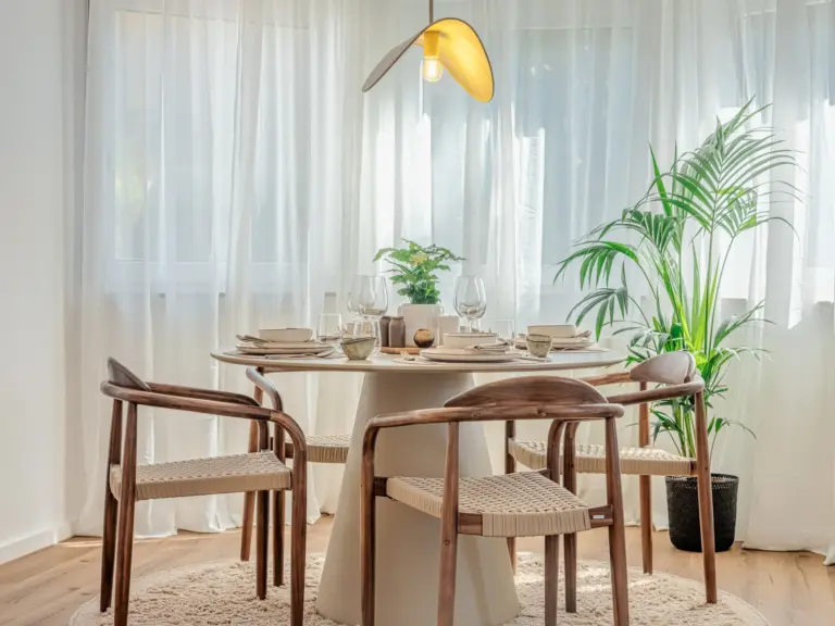 Dining area with modern table and decor at Stay Eden MOONSTONE GREEN, a Ramstein TDY home.