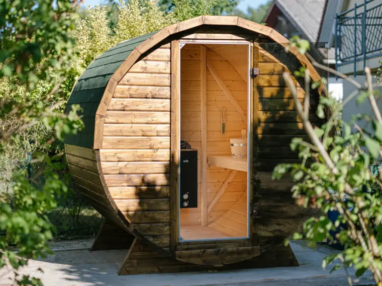 Finnish sauna at the Stay Eden MOONSTONE GREEN apartment in Ramstein, featuring a classic wooden interior for a relaxing wellness experience.