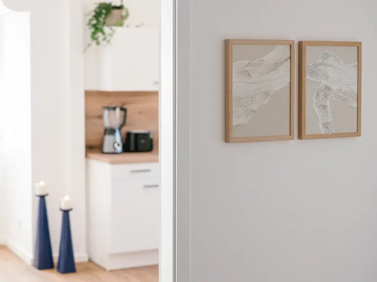 Kitchen decor with modern cabinetry and warm accents at Stay Eden MOONSTONE GREEN, a Ramstein TDY apartment.