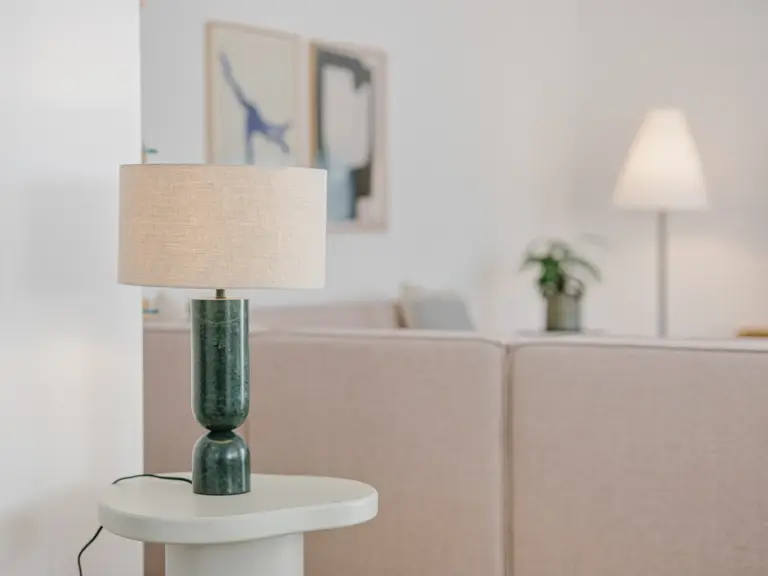 Ambient lighting in the living room of the Stay Eden MOONSTONE GREEN apartment in Ramstein, creating a warm and relaxing atmosphere.