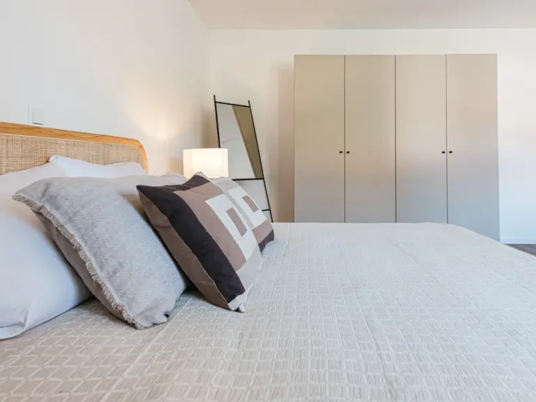 Master bedroom with wardrobe and king-size bed at Stay Eden MOONSTONE GREEN, a Ramstein TDY apartment.