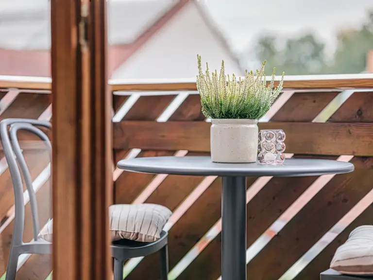 Balcony with outdoor seating and scenic view at Stay Eden TOPAZ BLUE near Ramstein Air Base.