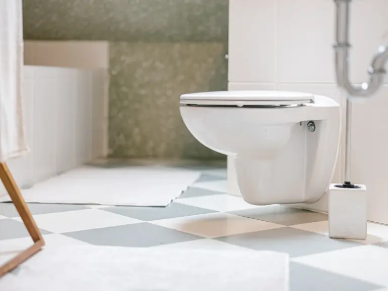 Bathroom with modern toilet and clean light tiles at Stay Eden TOPAZ BLUE near Ramstein Air Base.