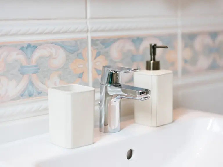 Bathroom with modern wash basin and bright lighting at Stay Eden TOPAZ BLUE near Ramstein Air Base.