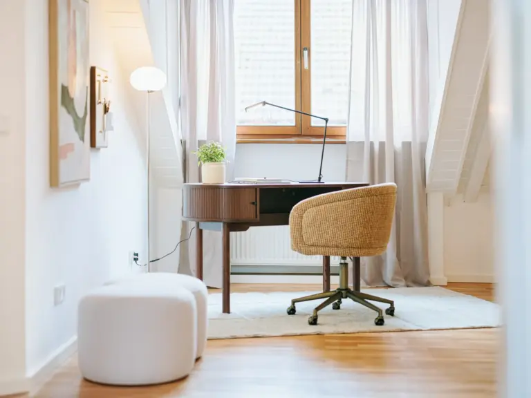Bright dedicated workspace with desk and natural light at Stay Eden TOPAZ BLUE near Ramstein Air Base.
