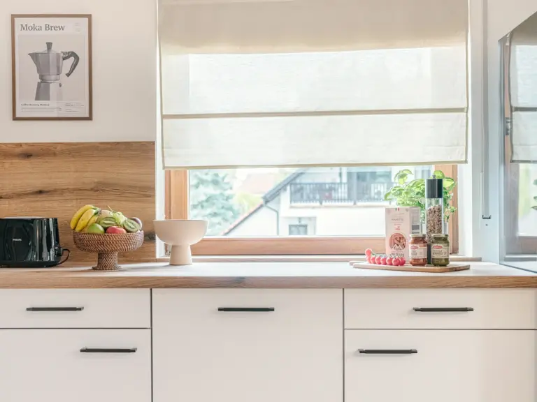 Bright kitchen with white cabinets and modern appliances at Stay Eden TOPAZ BLUE near Ramstein Air Base.