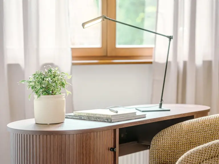 Close-up of dedicated workspace with modern desk and decor at Stay Eden TOPAZ BLUE near Ramstein Air Base.