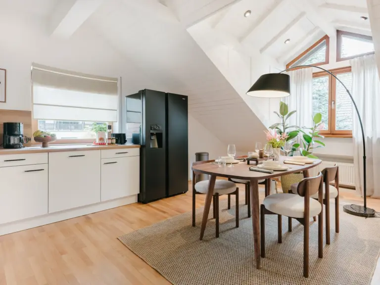 Kitchen and dining area with modern furnishings at Stay Eden TOPAZ BLUE near Ramstein Air Base.