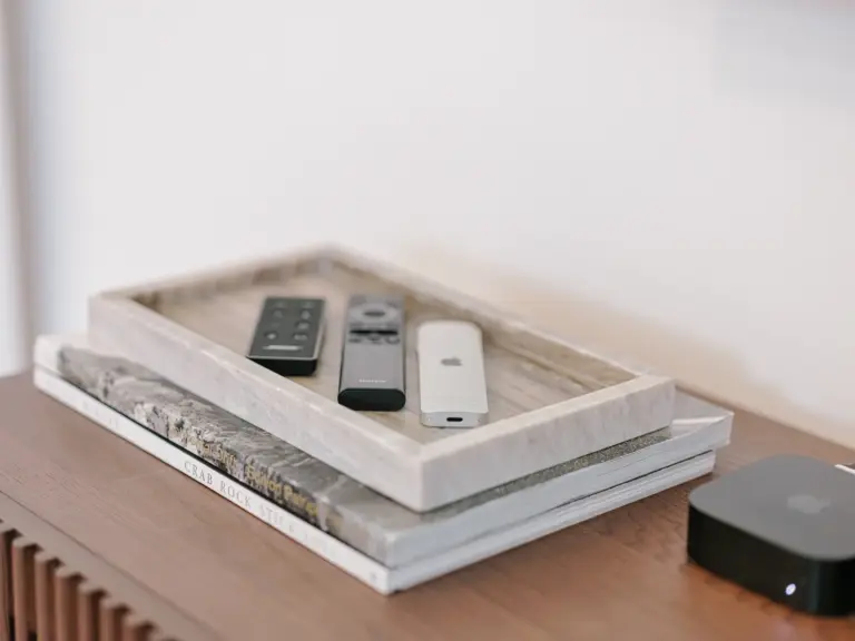 Living room remote controls on sideboard at Stay Eden TOPAZ BLUE near Ramstein Air Base.