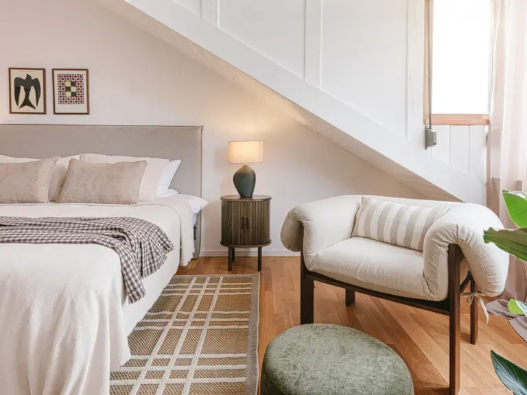 Side view of master bedroom with king-size bed and soft lighting at Stay Eden TOPAZ BLUE near Ramstein Air Base.