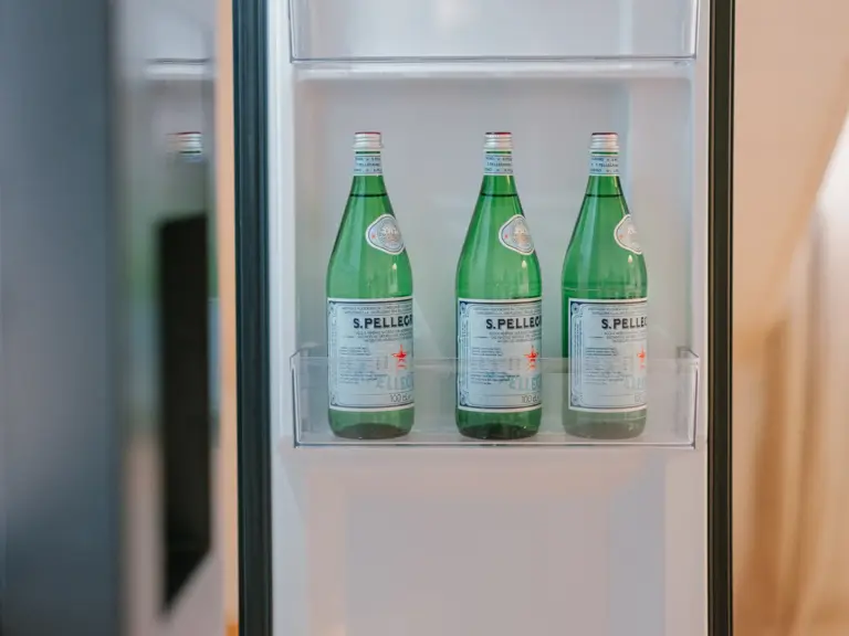 Pre-filled side-by-side fridge with beverages at Stay Eden TOPAZ BLUE near Ramstein Air Base.