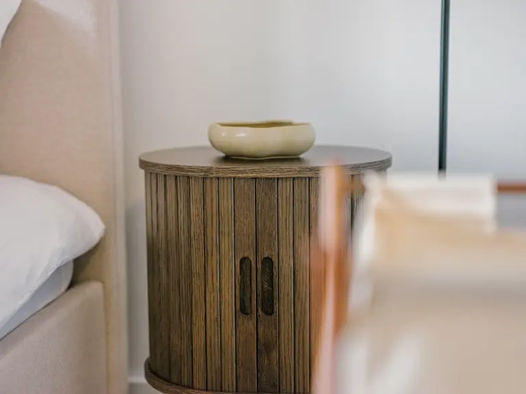 Master bedroom with stylish nightstand and king-size bed at Stay Eden TOPAZ GREEN near Ramstein Air Base.