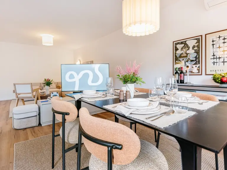 Open dining and living room with modern decor at Stay Eden TOPAZ GREEN near Ramstein Air Base.