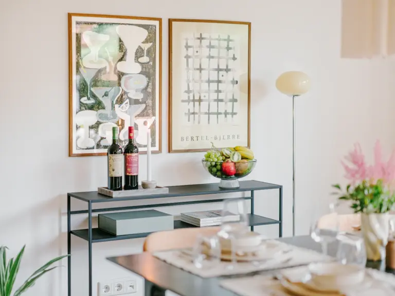 Dining room table with elegant decor and soft lighting at Stay Eden TOPAZ GREEN near Ramstein Air Base.
