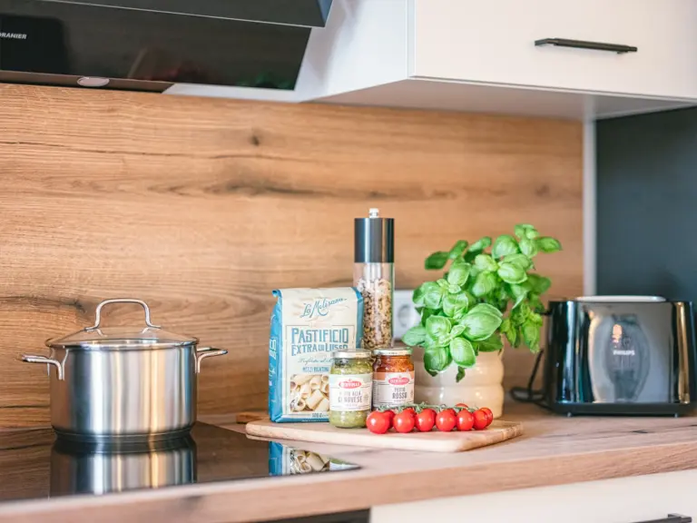 Modern kitchen with cooking area and appliances at Stay Eden TOPAZ GREEN near Ramstein Air Base.