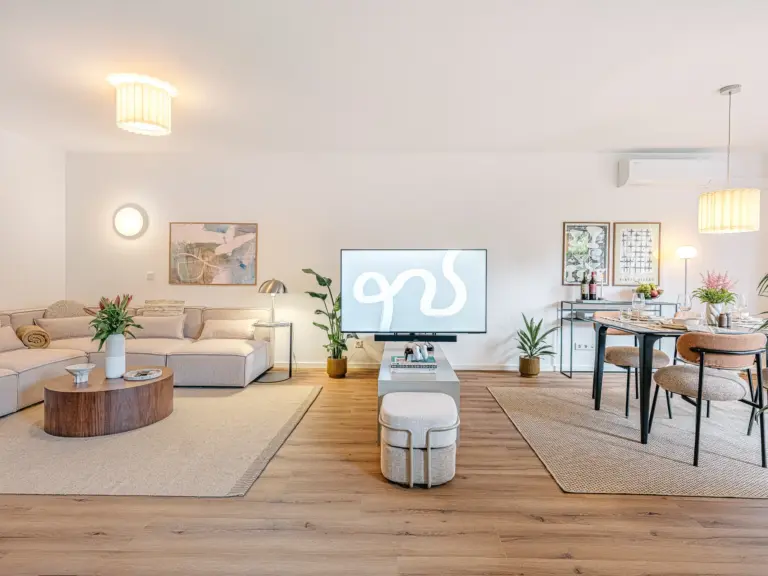 Open living and dining area with modern furnishings at Stay Eden TOPAZ GREEN near Ramstein Air Base.
