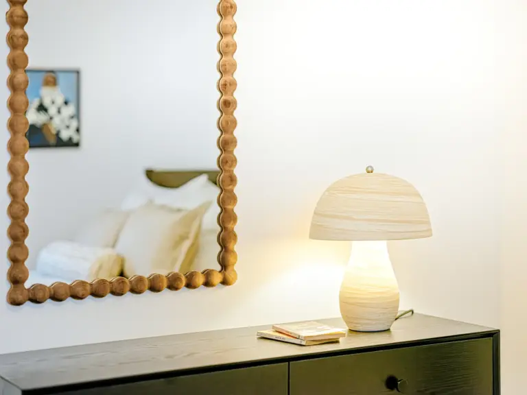 Second bedroom with mirror and queen-size bed at Stay Eden TOPAZ GREEN near Ramstein Air Base.